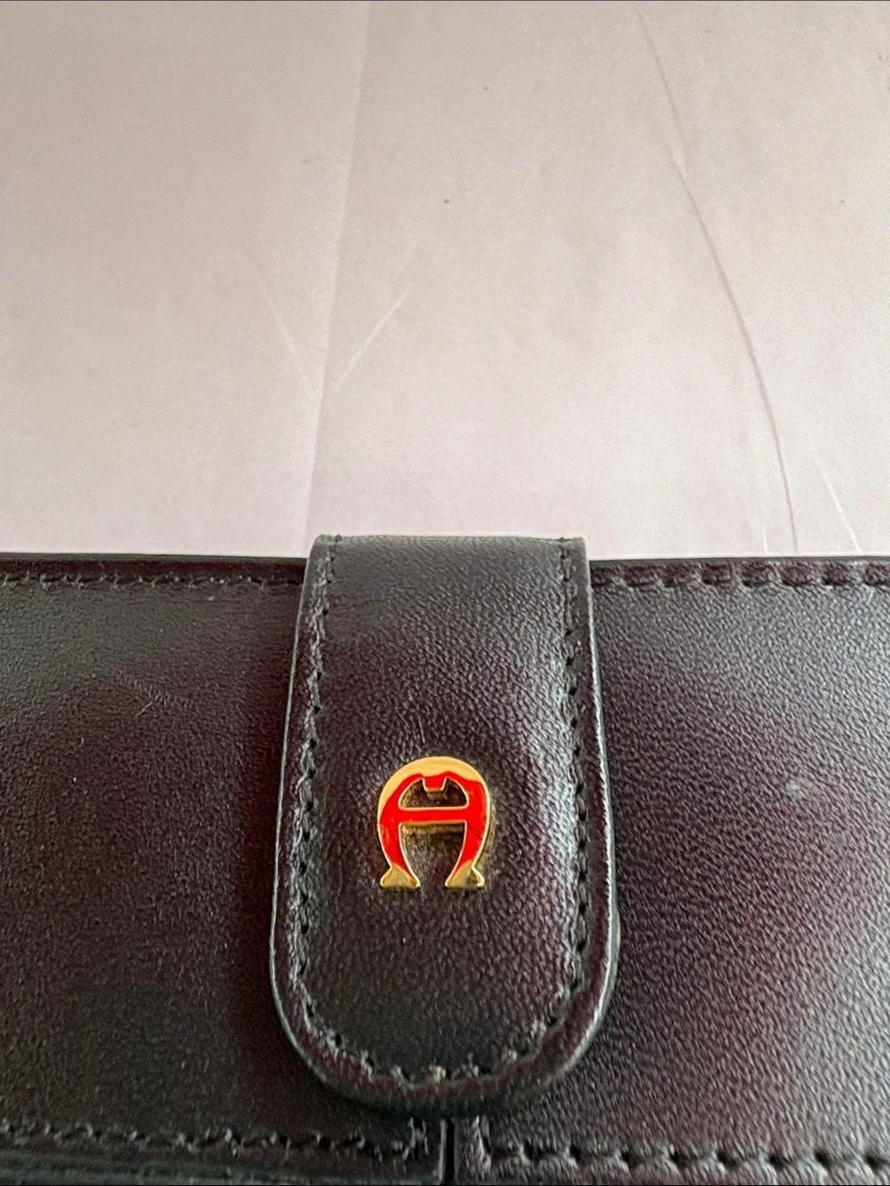 Compact Black Leather Women's Wallet with Snap Tab Etienne Aigner.